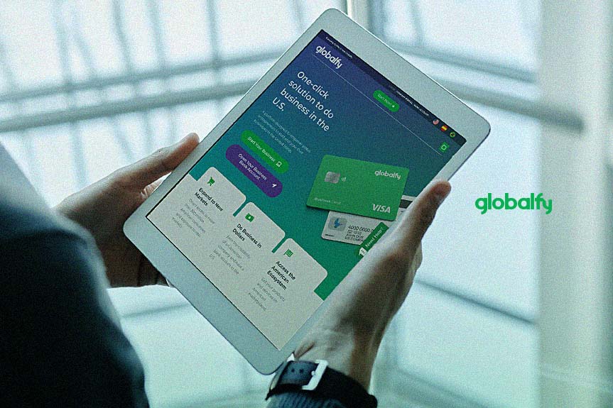 man using tablet with globalfy banking page on it