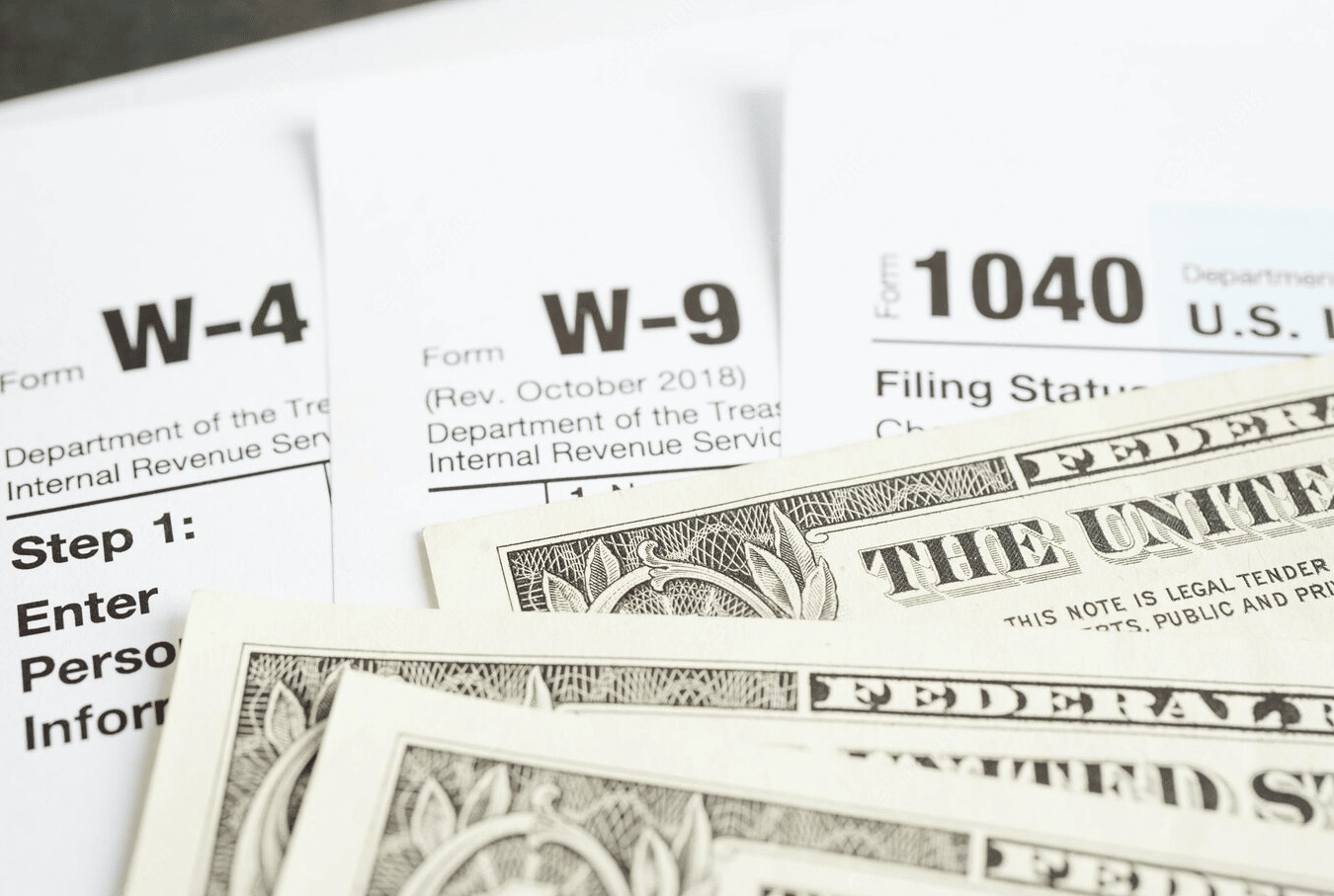 IRs forms and dollar bills