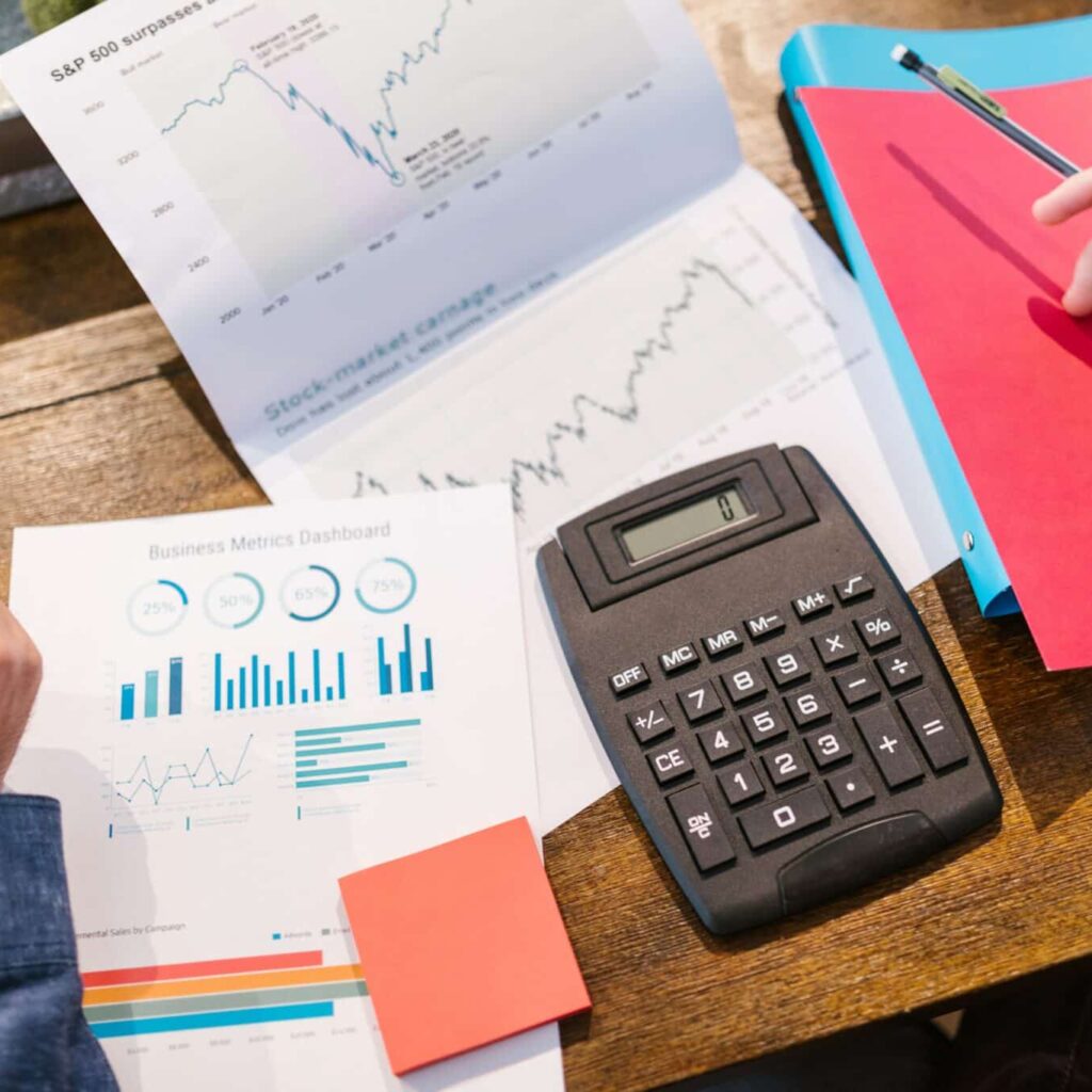 Charts and a calculator on a table