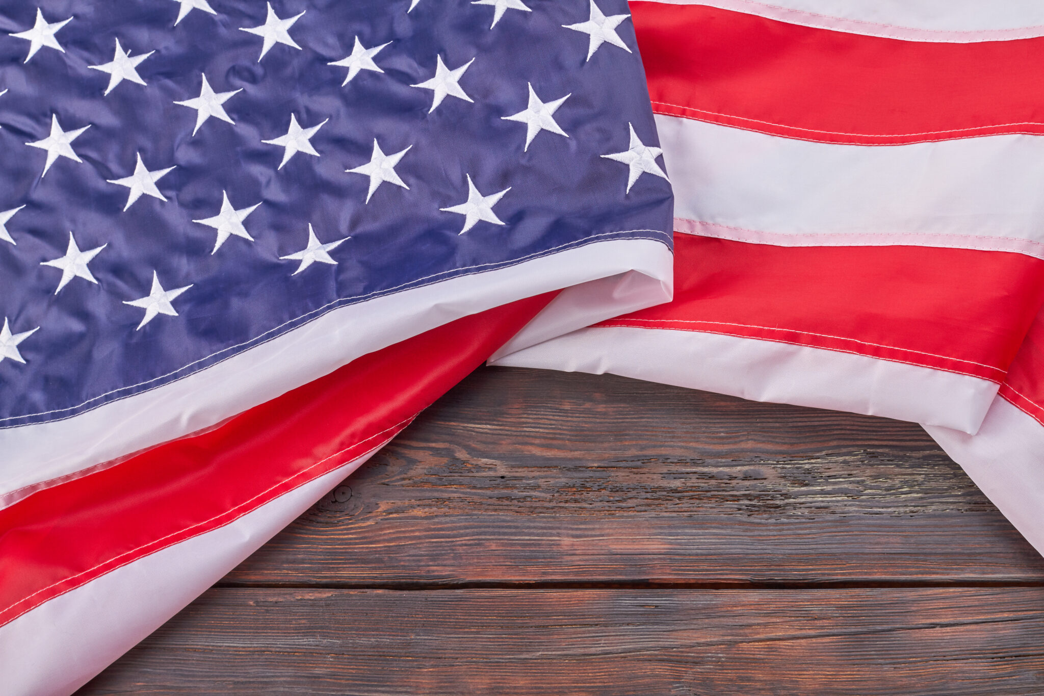 Close-up large fabric United States flag on wood